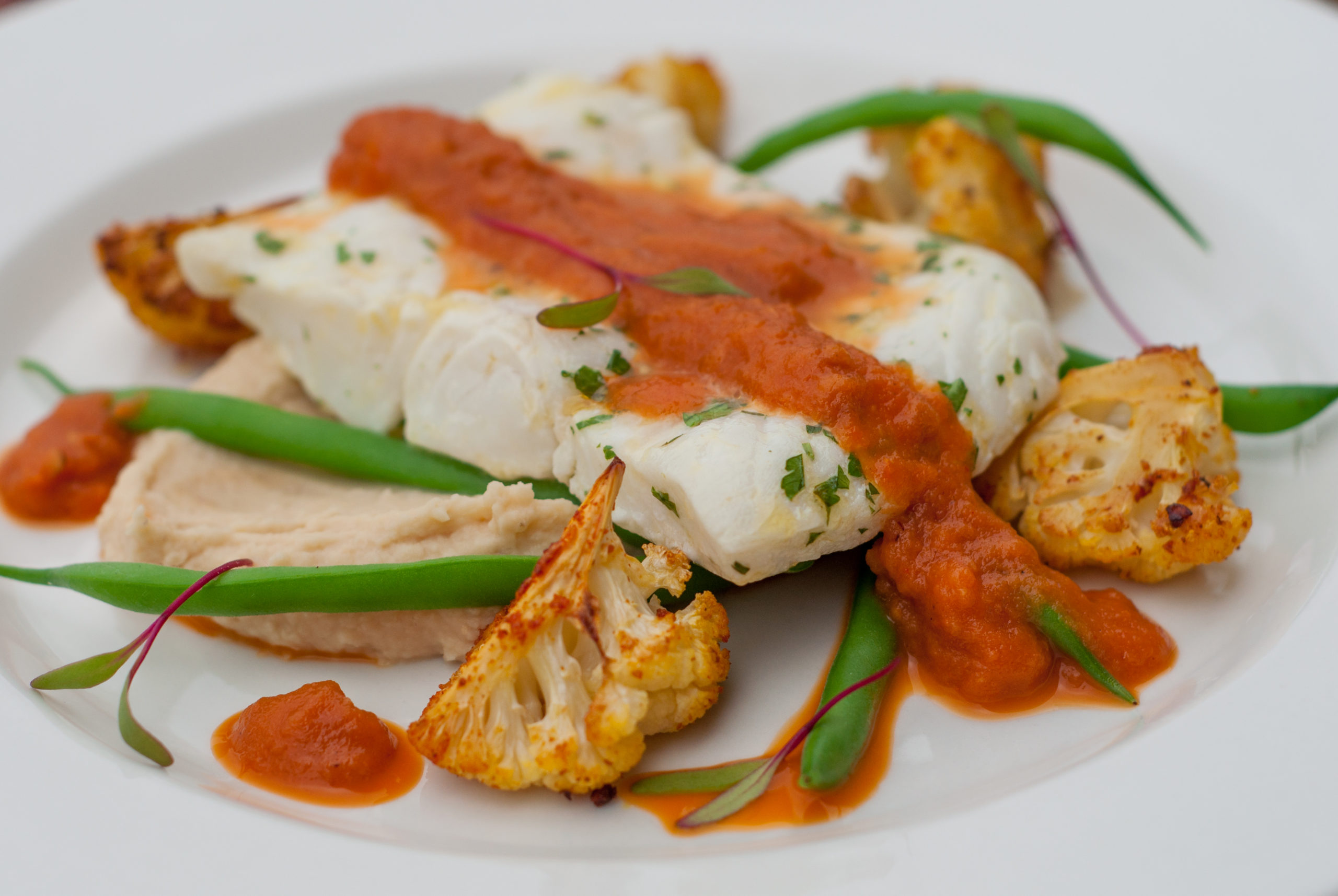 Baked Hake, Masala Cauliflower, Roasted Tomato Peri Peri, Butterbean