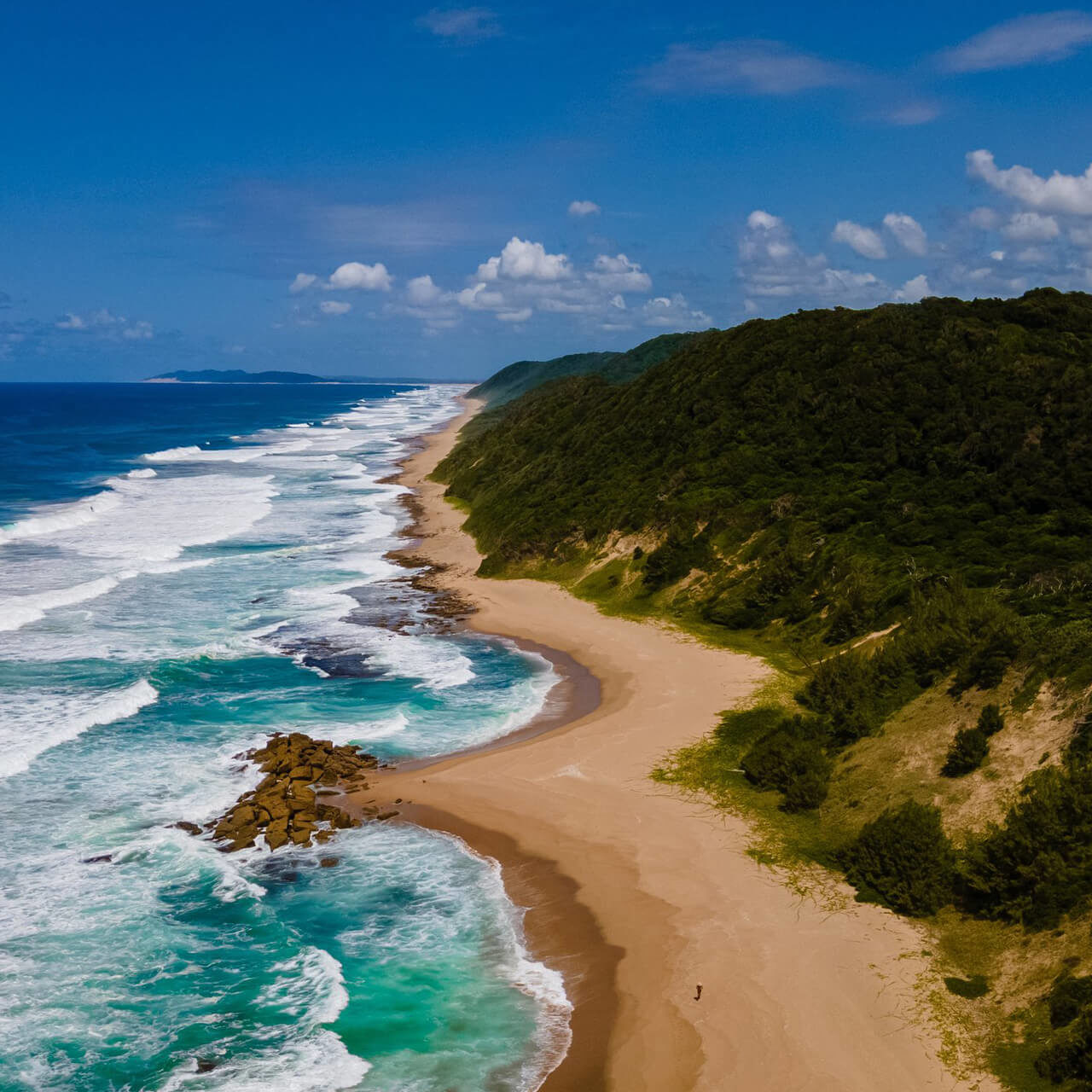 St+Lucia+South+Africa,+sand,+ocean,+blue+coastal+skyline+at+Mission+Rocks+beach+near+Cape+Vidal+in+Isimangaliso+Wetland+Park+in+Zululand